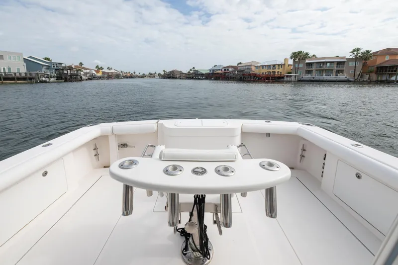 Slide: The Image of 2005 Cabo 35 Flybridge boat deck overlooking waterfront homes. - 11