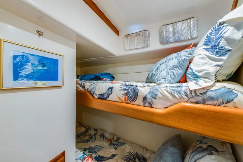Slide: The Image of Cozy cabin with bunk beds in 2005 Cabo 35 Flybridge yacht. - 24