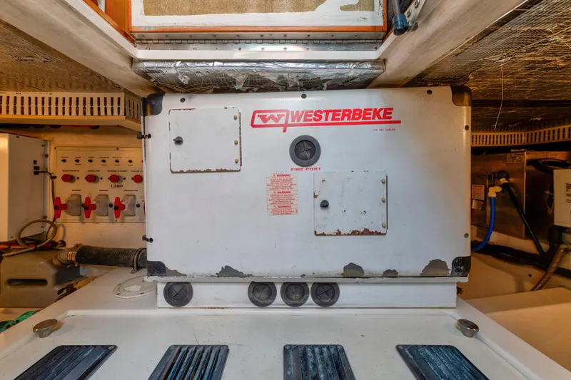 Slide: The Image of Engine room of 2005 Cabo 35 Flybridge with Westerbeke generator. - 29