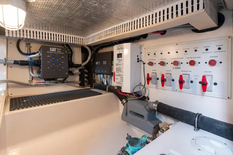 Slide: The Image of Electrical panel and components inside a 2005 Cabo 35 Flybridge boat engine room. - 33