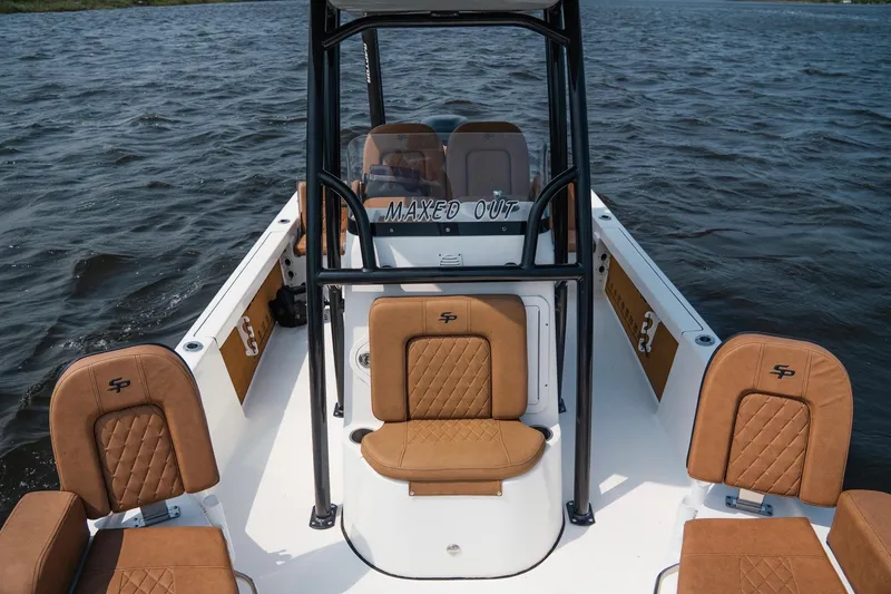 Slide: The Image of 2022 Sea Pro 228 Bay boat interior with tan seating on open water. - 15