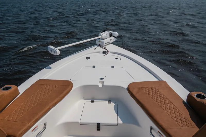 Slide: The Image of 2022 Sea Pro 228 Bay boat with brown seating on open water. - 17