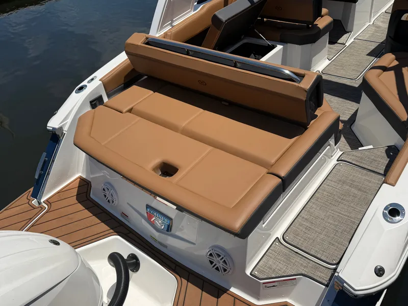 Slide: The Image of 2024 Cobalt R4 OB boat with brown seating by the water. - 8