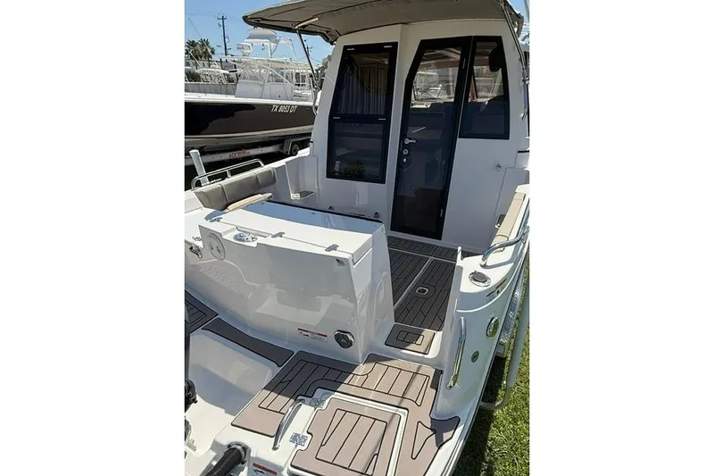 Slide: The Image of 2025 Cutwater C-248 Coupe boat with spacious deck and modern design. - 10