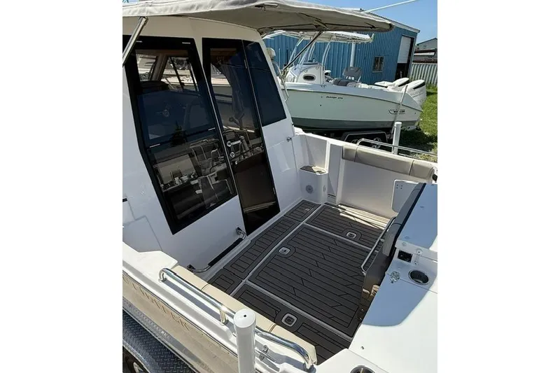Slide: The Image of 2025 Cutwater C-248 Coupe boat with spacious deck and modern design. - 11