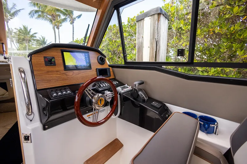 Slide: The Image of Manufacturer Provided Image: 2025 Cutwater C-248 Coupe helm with modern controls and navigation system. - 15