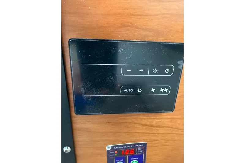 Slide: The Image of Control panel of 2025 Cutwater C-248 Coupe, featuring temperature and fan settings. - 23