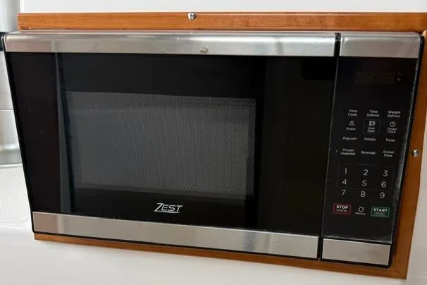 Slide: The Image of Built-in Zest microwave in 2025 Cutwater C-248 Coupe boat kitchen. - 25