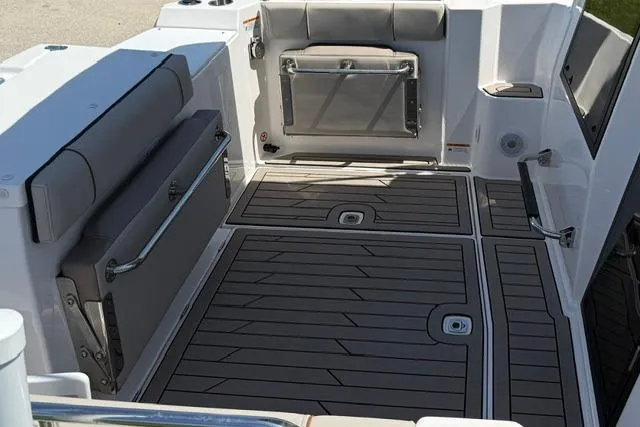 Slide: The Image of 2025 Cutwater C-248 Coupe boat deck with cushioned seating and sleek design. - 7