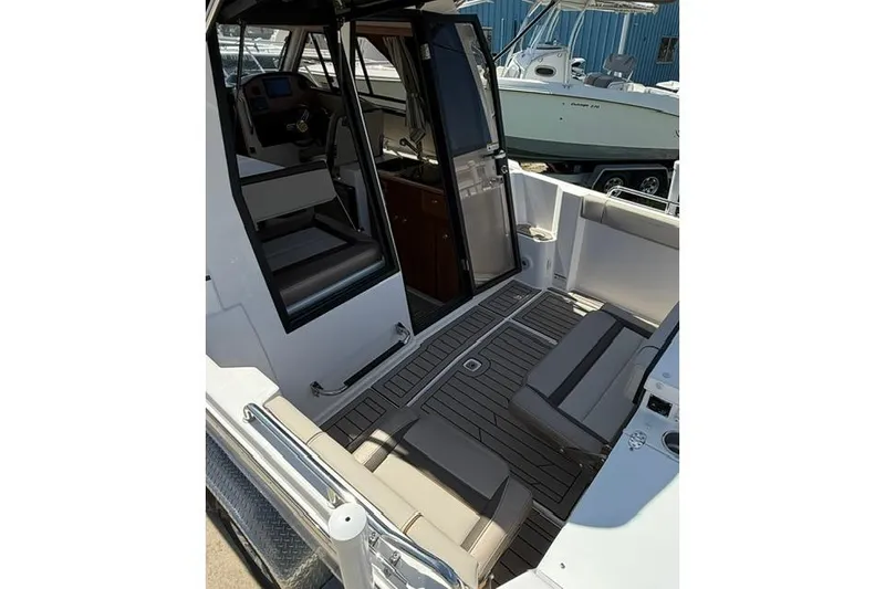 Slide: The Image of 2025 Cutwater C-248 Coupe interior with seating and helm, showcasing modern design and functionality. - 8