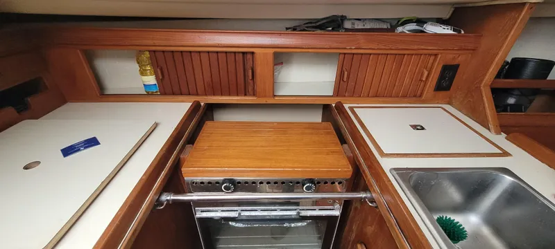 Slide: The Image of Interior of Island Packet 31 yacht kitchen, 1987 model. - 11
