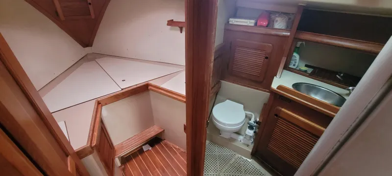 Slide: The Image of Interior of a 1987 Island Packet 31 yacht with toilet and sink. - 13