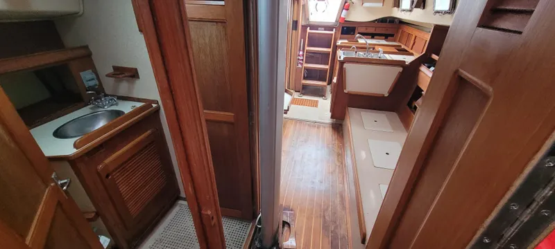 Slide: The Image of Interior of a 1987 Island Packet 31 yacht with wooden finish. - 14
