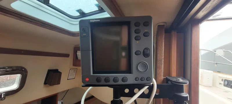 Slide: The Image of Interior view of a 1987 Island Packet 31 sailboat with navigation system. - 19