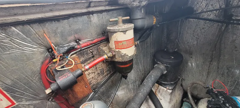 Slide: The Image of Engine compartment of a 1987 Island Packet 31 with fuel filter. - 34