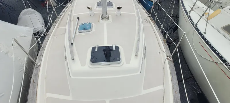 Slide: The Image of Deck of a 1987 Island Packet 31 sailboat in harbor. - 41