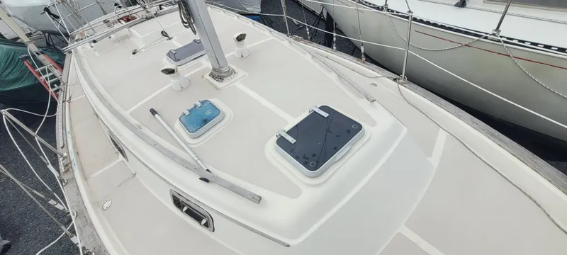 Slide: The Image of Deck of a 1987 Island Packet 31 sailboat in harbor. - 47