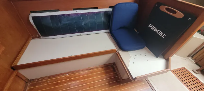 Slide: The Image of Interior of a 1987 Island Packet 31 yacht with seating area. - 5