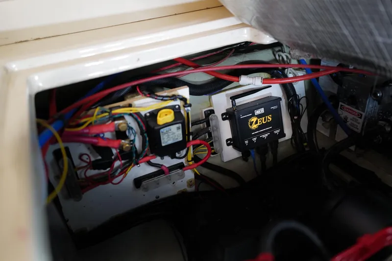Slide: The Image of Electrical system inside a 2006 Leopard 43 boat, featuring wiring and a Zeus control unit. - 101