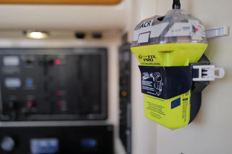 Slide: The Image of Emergency beacon on a 2006 Leopard 43 yacht, mounted near control panel. - 105