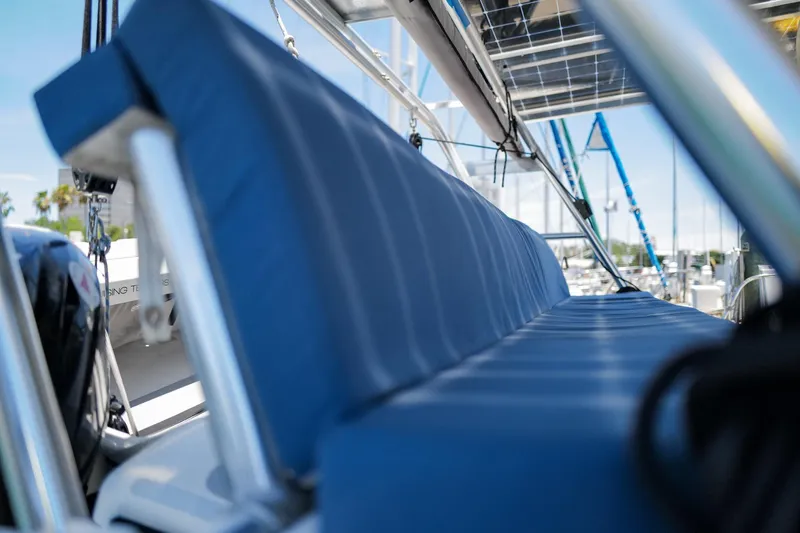 Slide: The Image of Blue cushioned seating on a 2006 Leopard 43 catamaran deck. - 12