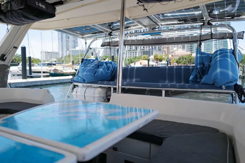 Slide: The Image of Interior view of a 2006 Leopard 43 catamaran with marina backdrop. - 13