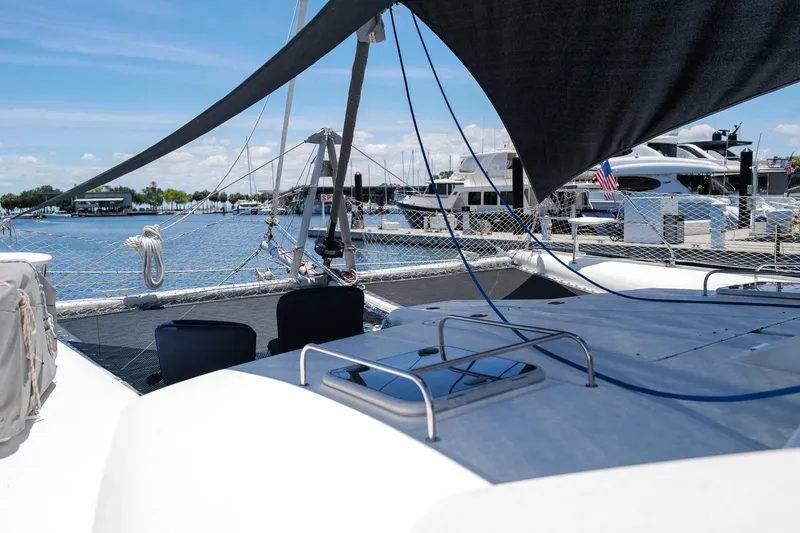 Slide: The Image of 2006 Leopard 43 yacht docked at marina with clear blue sky. - 21