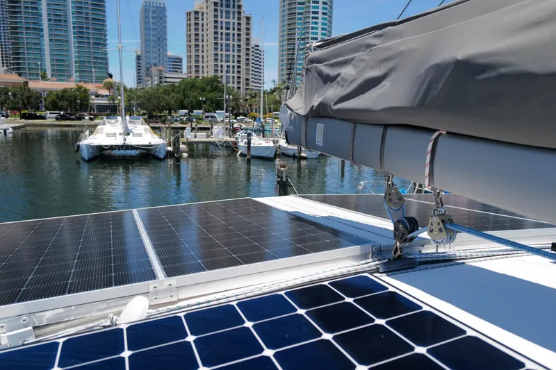Slide: The Image of Solar panels on a 2006 Leopard 43 catamaran docked in a marina. - 23
