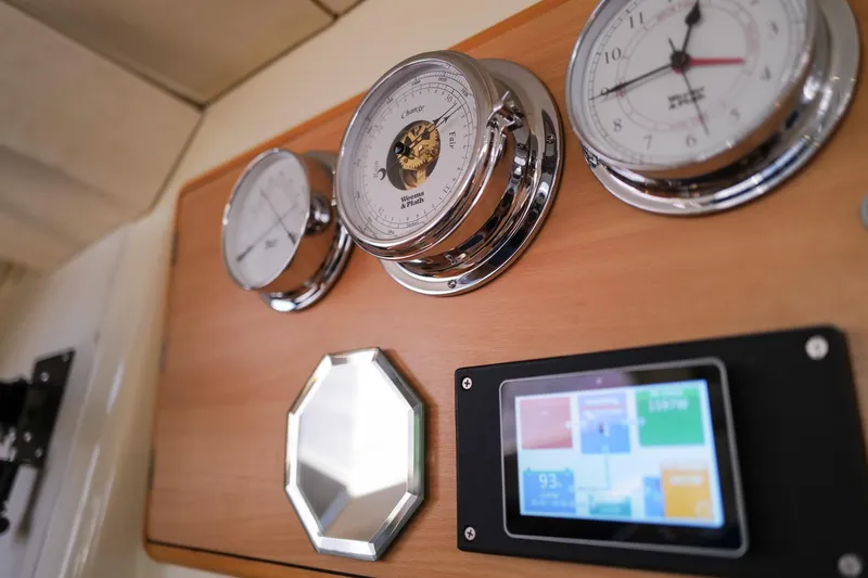 Slide: The Image of Control panel of a 2006 Leopard 43 yacht with gauges and digital display. - 26