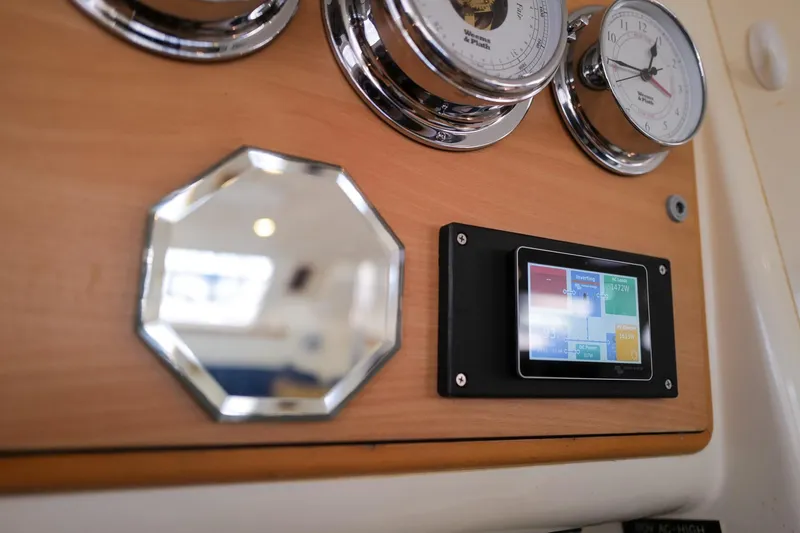 Slide: The Image of Control panel of a 2006 Leopard 43 yacht with gauges and digital display. - 27