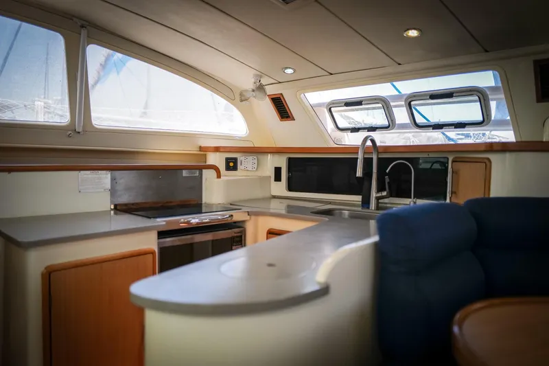 Slide: The Image of Interior of 2006 Leopard 43 yacht kitchen with modern amenities and sleek design. - 31