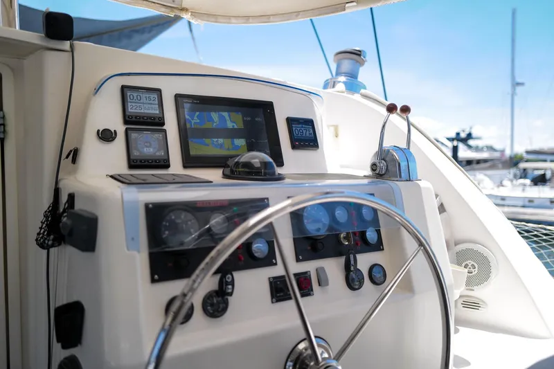 Slide: The Image of Steering console of a 2006 Leopard 43 yacht with navigation instruments and controls. - 4