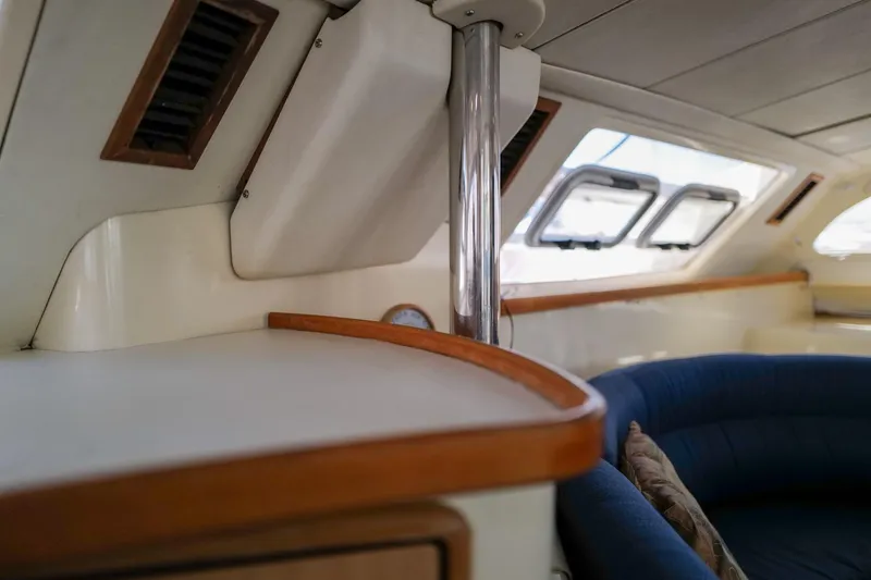 Slide: The Image of Interior of a 2006 Leopard 43 yacht, featuring a cozy seating area and sleek design. - 42