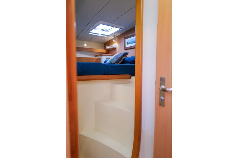 Slide: The Image of Interior cabin view of 2006 Leopard 43 yacht with cozy bed and skylight. - 55