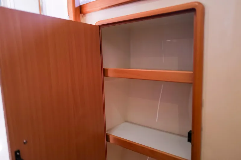 Slide: The Image of Wooden cabinet with open door and shelves, Leopard 43, 2006 model interior. - 57