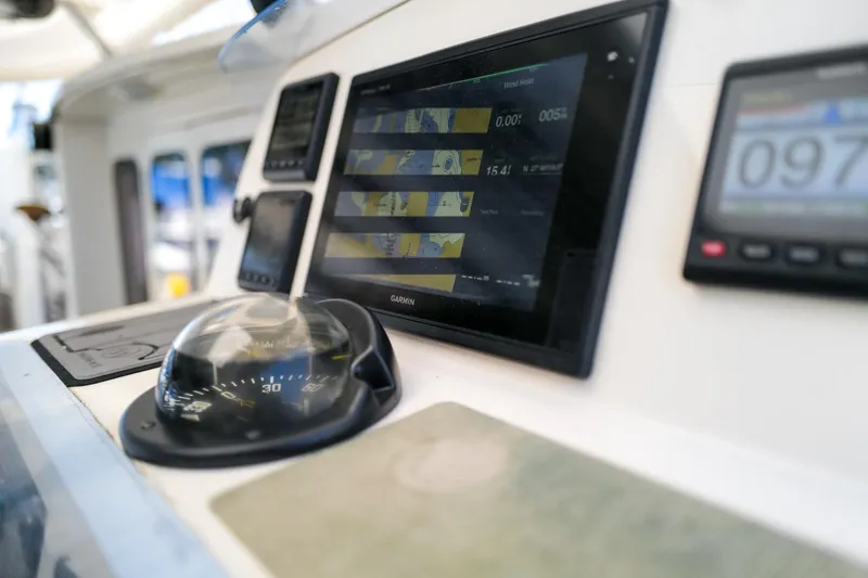Slide: The Image of Control panel of a 2006 Leopard 43 yacht with navigation instruments. - 6