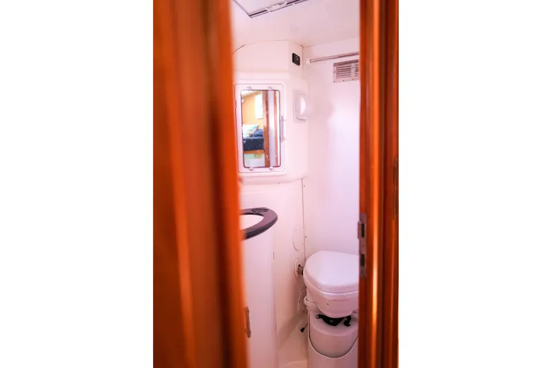 Slide: The Image of Compact bathroom interior of 2006 Leopard 43 yacht with toilet and sink. - 64
