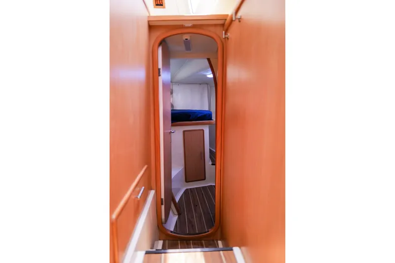 Slide: The Image of Interior view of a 2006 Leopard 43 yacht cabin with wooden finish. - 70