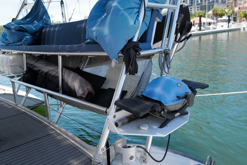Slide: The Image of Sailing yacht Leopard 43, 2006 model, with deck equipment and blue cover, docked at marina. - 79