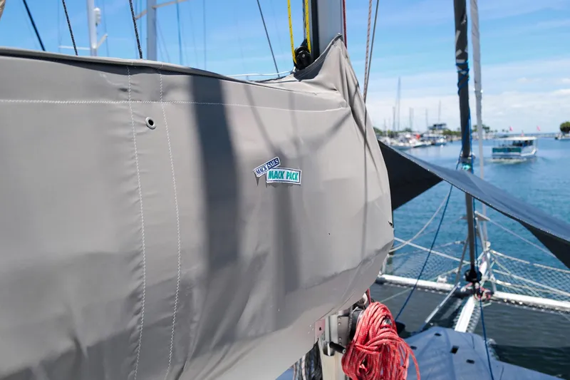 Slide: The Image of Sailboat with Mack Sails cover, Leopard 43 model, docked in marina, 2006. - 89