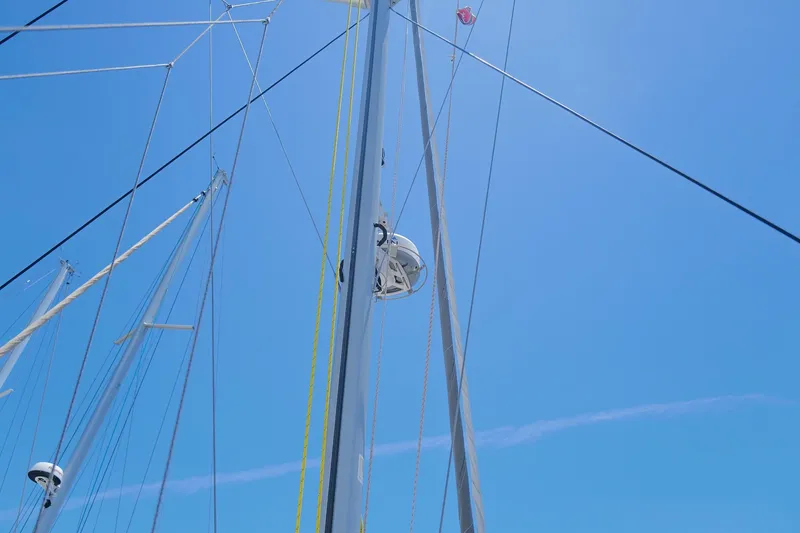 Slide: The Image of Sailboat masts and rigging against a clear blue sky, Leopard 43, 2006 model. - 91