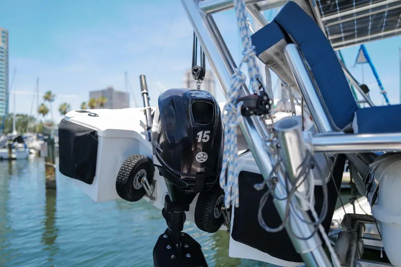 Slide: The Image of Outboard motor on a 2006 Leopard 43 catamaran, docked in a marina. - 93