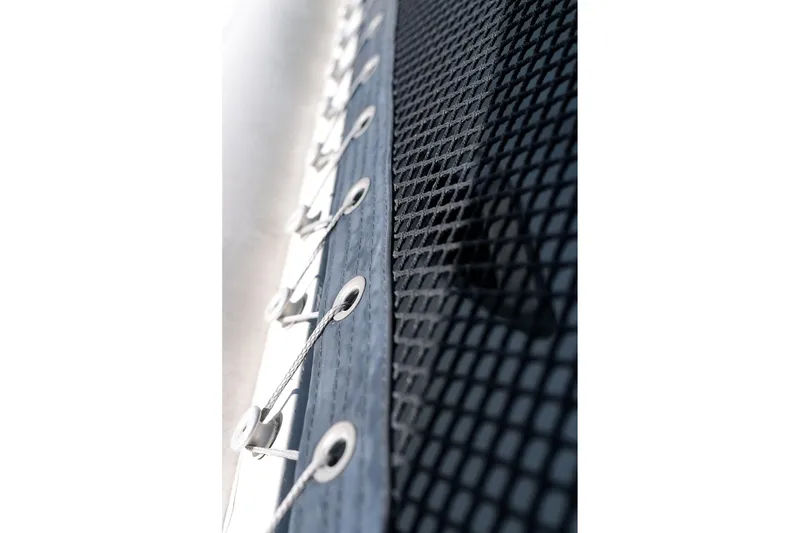 Slide: The Image of Close-up of a 2006 Leopard 43 catamaran netting and lacing detail. - 98