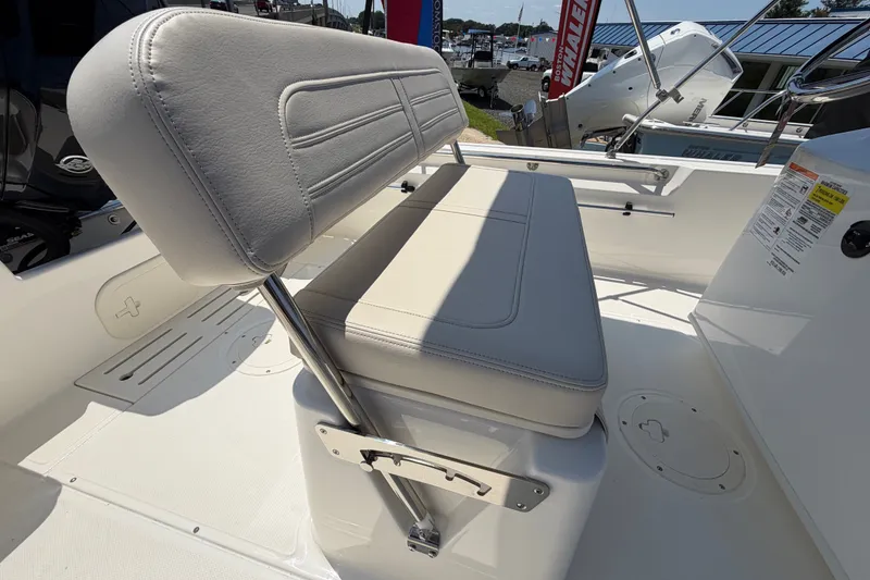 Slide: The Image of The 2027 Boston Whaler 170 Montauk features a cushioned bench seat with stainless steel supports. - 9