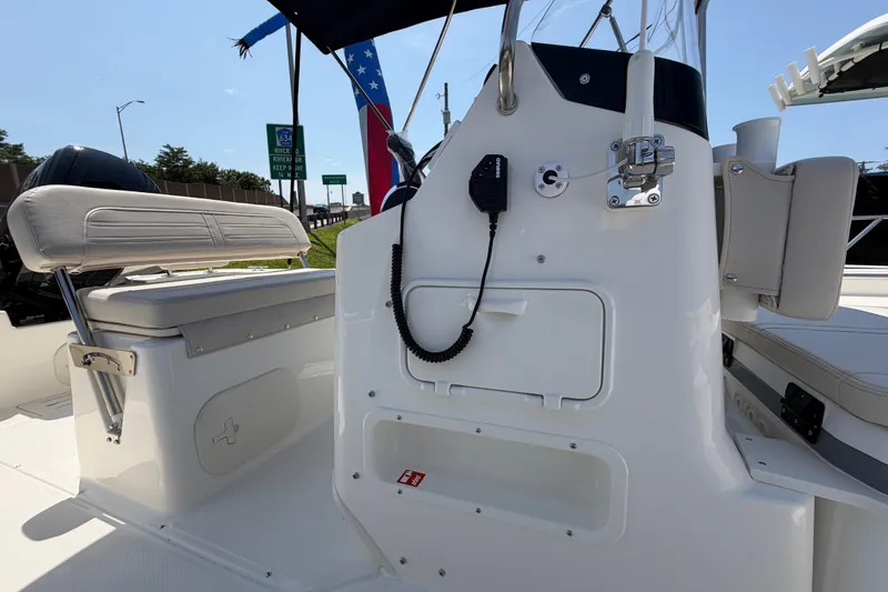 Slide: The Image of The image shows the cockpit of a 2027 Boston Whaler 170 Montauk with a bench seat and helm console. - 6