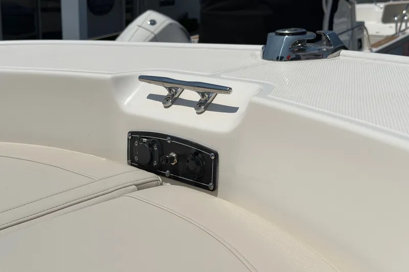 Slide: The Image of Close-up of a boat deck featuring a stainless steel cleat and a control panel. - 2