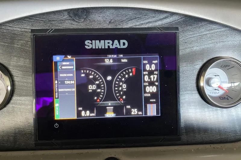 Slide: The Image of Simrad display on 2018 Harris Solstice 240 boat dashboard showing engine metrics. - 10