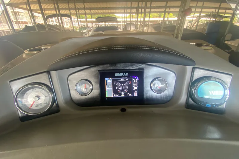 Slide: The Image of Dashboard of 2018 Harris Solstice 240 boat with Simrad display and gauges. - 11