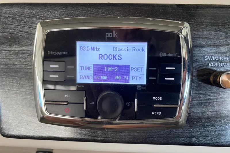 Slide: The Image of Polk audio system displaying 93.5 MHz classic rock station on Harris Solstice 240 boat. - 12