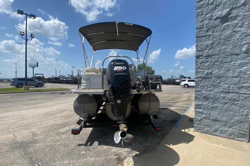 Slide: The Image of 2018 Harris Solstice 240 pontoon boat with 250 Pro motor in parking lot. - 3